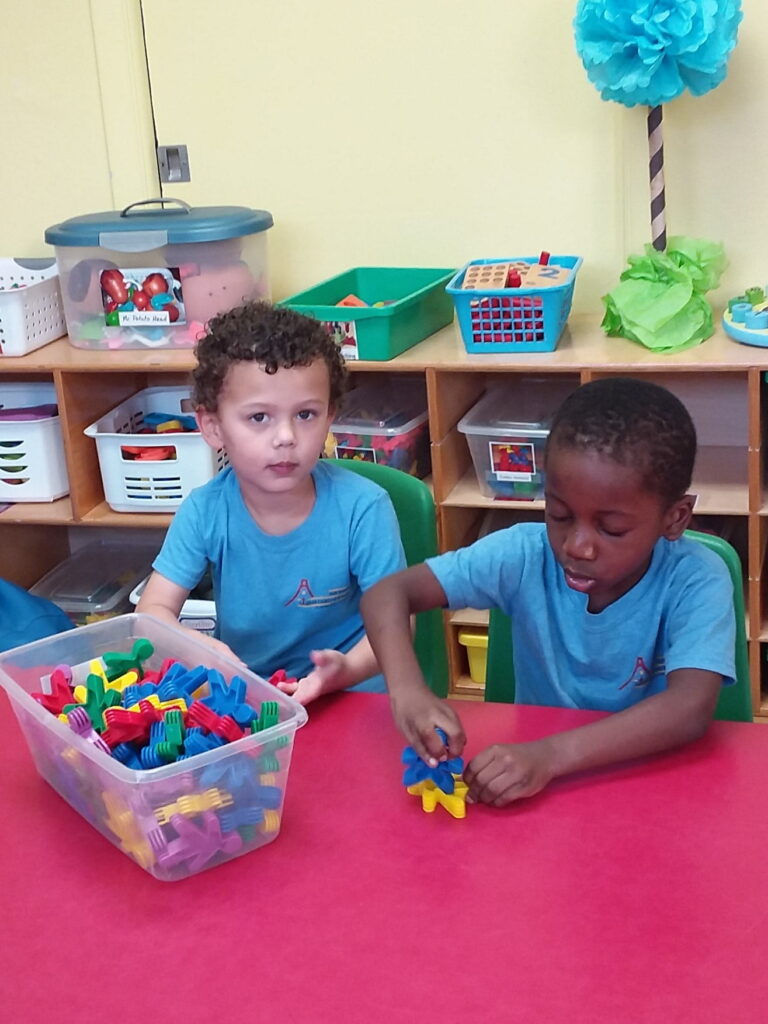 two boys building blocks