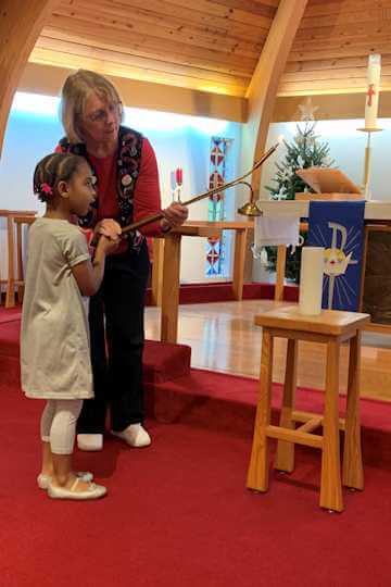 church lighting candle student