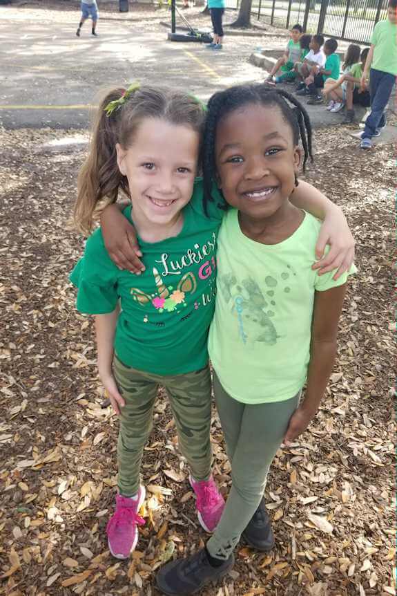 two girls embraced playground