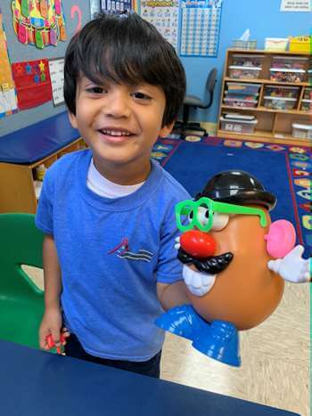 child with potato head